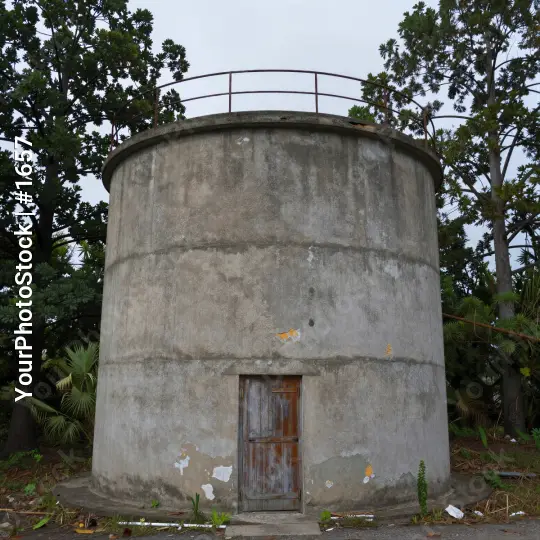 Dilapidated Concrete Structure with Rusty Railings
