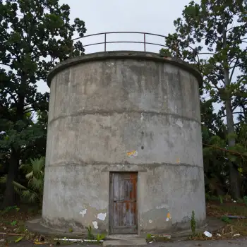Dilapidated Concrete Structure with Rusty Railings
