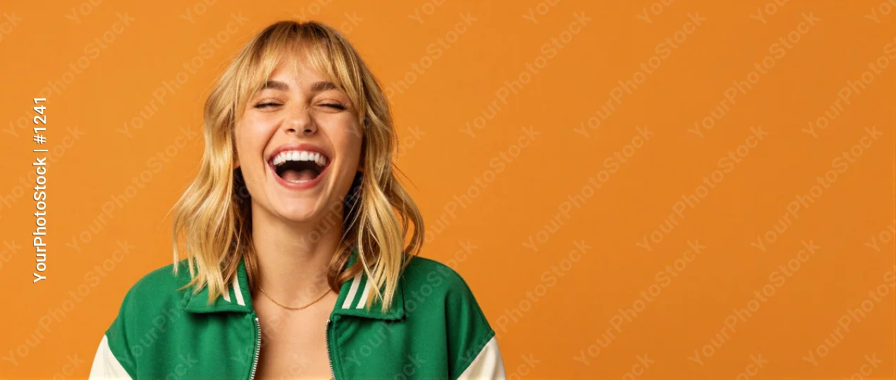 Young Woman Laughing with Closed Eyes, Green Jacket, Blonde Hair