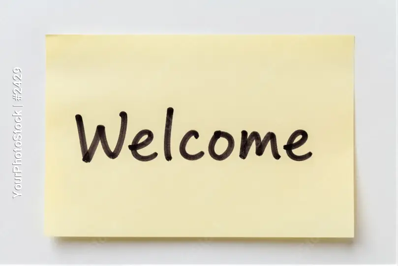 Welcome Note Hanging On White Wall sticky note