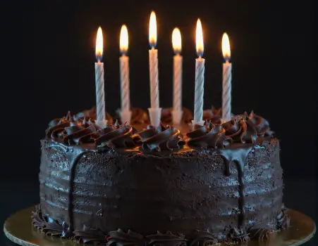 Chocolate Cake with Lit Candles for Birthday Celebration