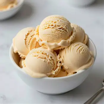 Vanilla Ice Cream Scoops in Bowl marble countertop