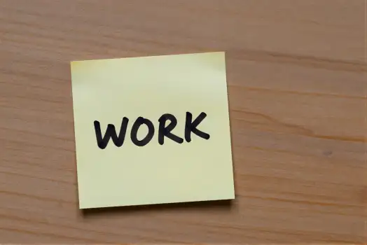 Work Sticky Note on Wood wooden surface organization