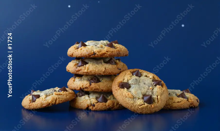 Stack of Golden Brown Chocolate Chip Cookies on Blue Background
