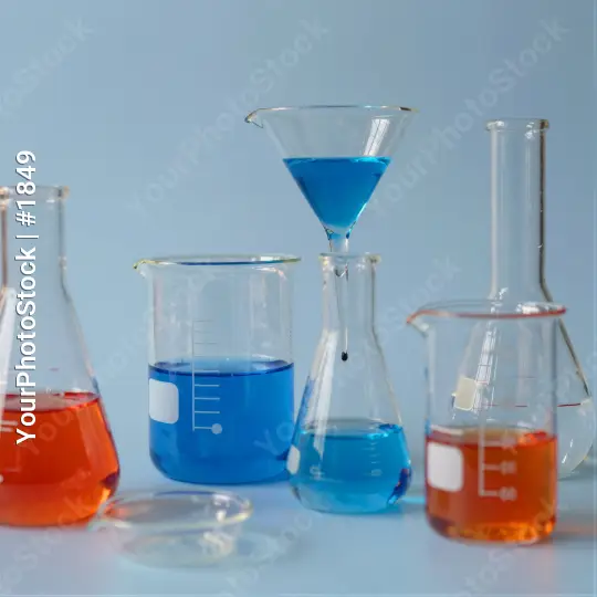 Laboratory Glassware Setup with Blue Liquid Funnel
