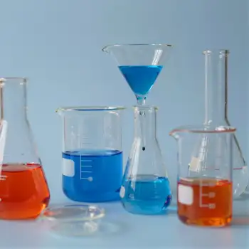 Laboratory Glassware Setup with Blue Liquid Funnel