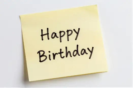 Yellow Sticky Note with Happy Birthday Cursive Text