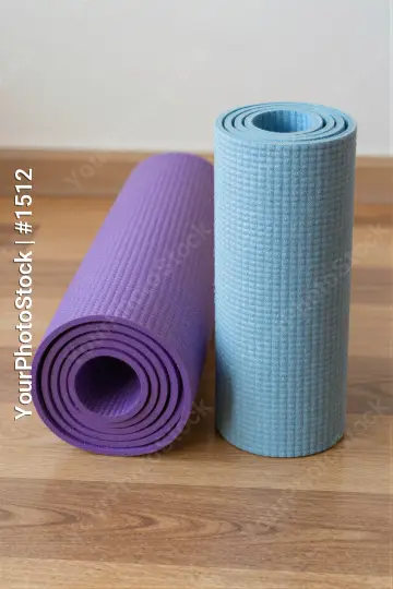 Yoga Mats Rolled Up on Wood Floor wooden floor