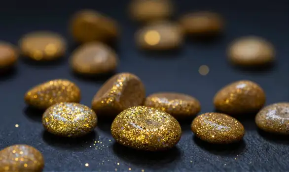 Golden Stones on Black Surface polished stones