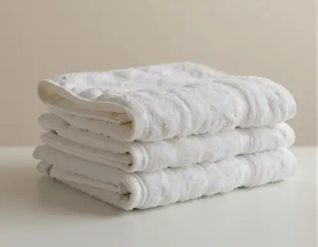 Neatly Folded White Towels on Surface stack textured hotel