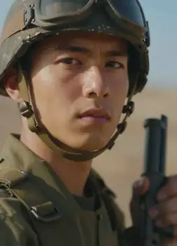 Young Asian Man in Military Uniform Holding Gun