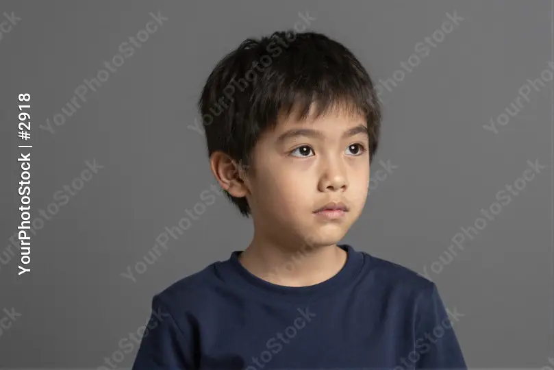 Young Boy Looking Off-Camera Portrait - Thoughtful Childhood Moment