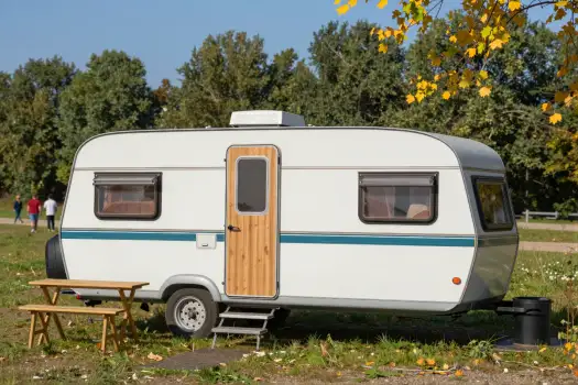 Vintage Caravan in Autumn Park outdoor travel