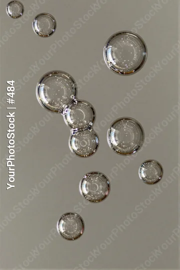 Group of Transparent Bubbles Floating in Air various sizes