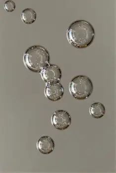 Group of Transparent Bubbles Floating in Air various sizes