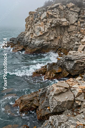 Rocky Coastline with Waves crashing waves overcast sky