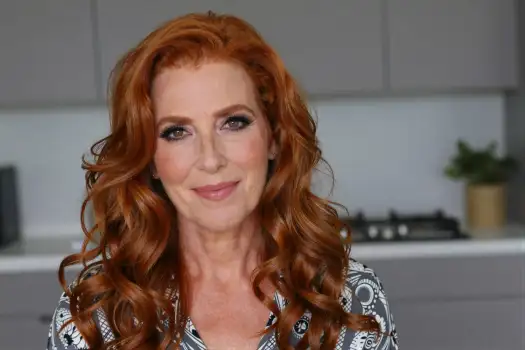 Woman with Long Red Hair in Kitchen Portrait blouse