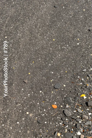 Wet Asphalt Surface with Pebbles and Objects rocks texture