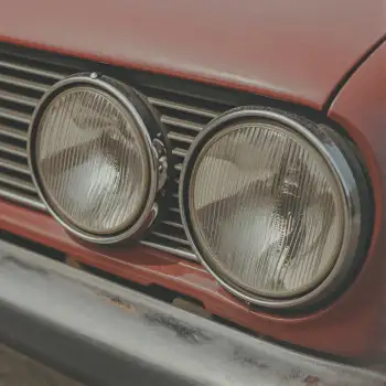 Red car front grille with chrome finish and new headlights