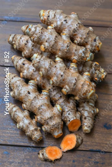 Fresh Ginger Root on Weathered Wood aged cracked