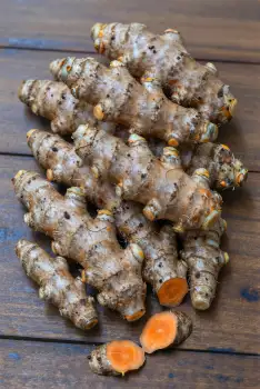Fresh Ginger Root on Weathered Wood aged cracked