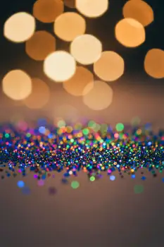 Glittery Surface with Bokeh Lights on Night Sky