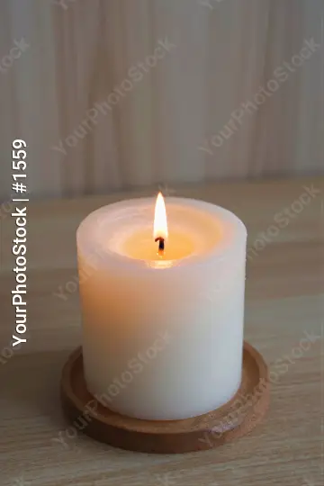 Lit White Candle on Wooden Surface lit candle