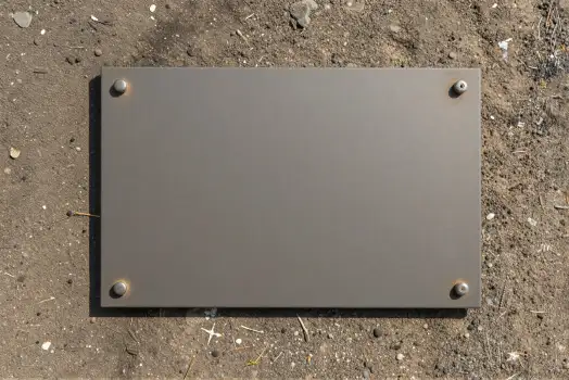 Metal Plate with Screws on Sandy Ground construction