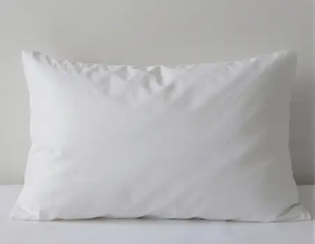 Soft Textured White Pillow on White Surface frayed hotel