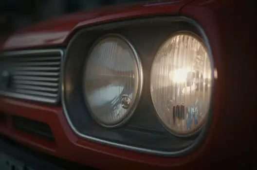 Red Car Grille with Headlights On chrome finish