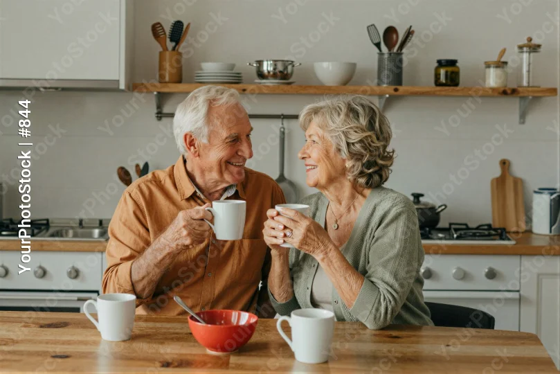 Elderly Couple Enjoying Coffee at Kitchen Table