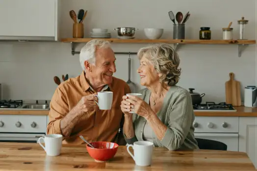 Elderly Couple Enjoying Coffee at Kitchen Table
