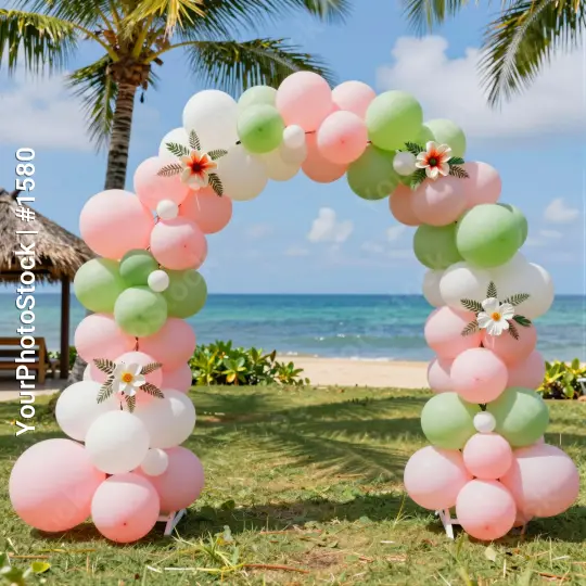 Pink and Green Balloon Arch with Flowers on Beach