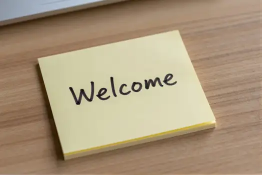 Welcome Note on Wooden Desk sticky laptop office