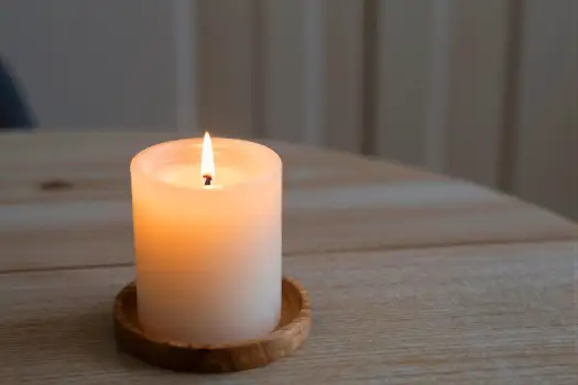 Lit White Candle on Wooden Holder lit candle peaceful