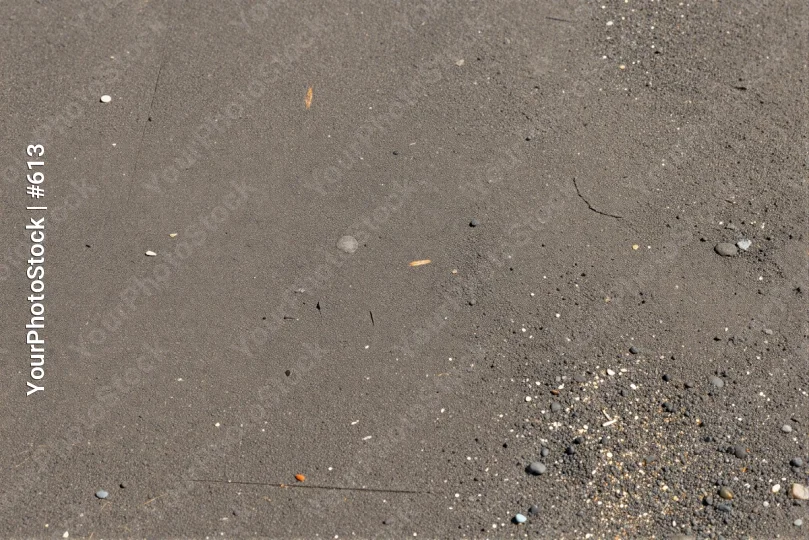 Dark Grey Sandy Beach Close-Up wet pebbles rocks