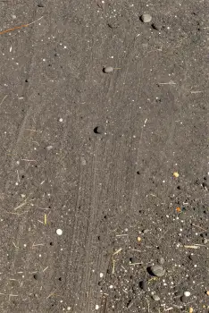 Close-up of Dark Grey Dirt with Circular Pattern ground