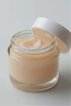 Light Peach Lotion Jar with Slightly Open Lid