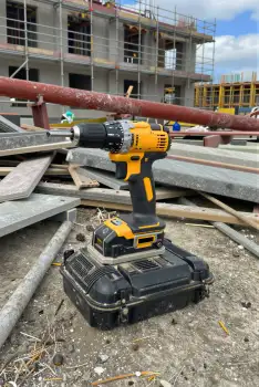 Construction Site Power Drill on Scaffolding building materials