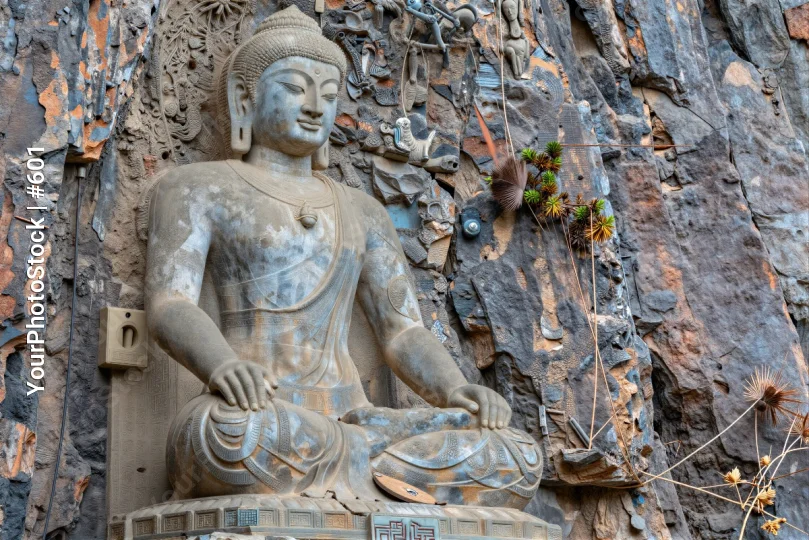 Seated Buddha Statue on Rocky Cliff stone carved