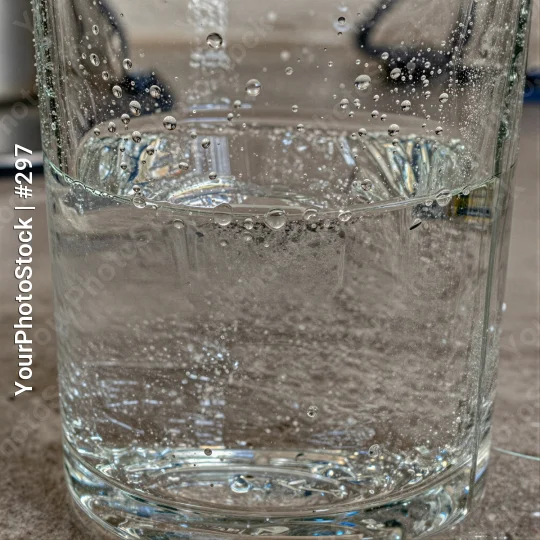 Close-up of a full glass of water with bubbles
