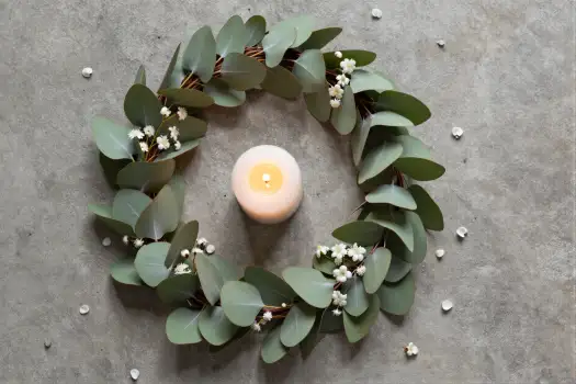 Minimalist Eucalyptus Wreath with Candle on Gray Surface