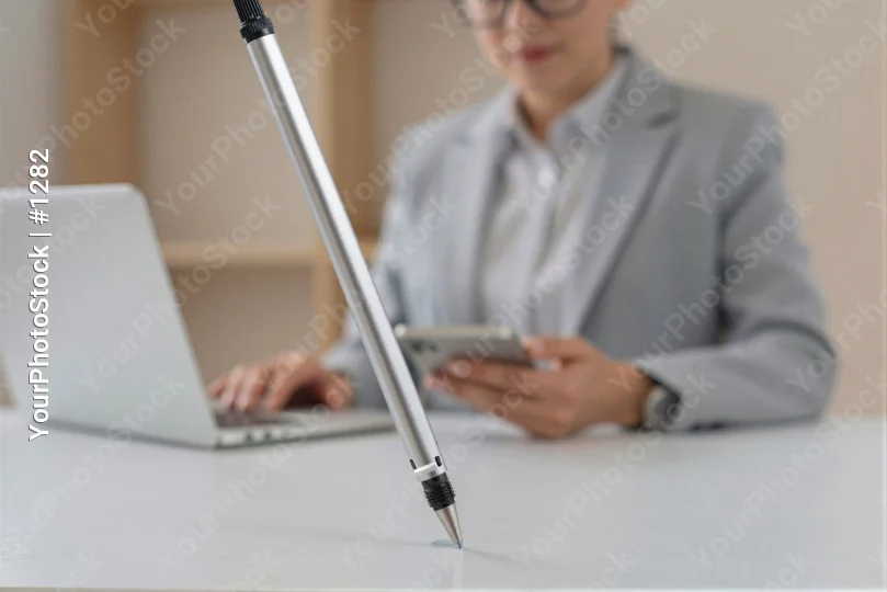 Professional Woman Working at Desk with Laptop