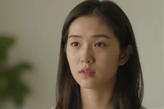 Young Asian Woman with Serious Expression close-up portrait