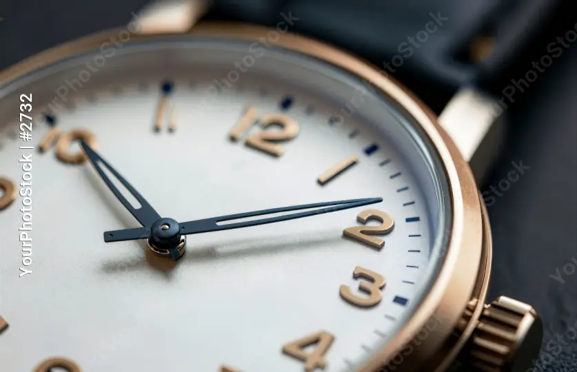 Classic Analog Clock with Gold Hands and Roman Numerals