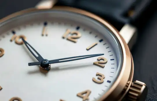 Classic Analog Clock with Gold Hands and Roman Numerals