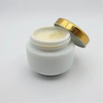 White Plastic Jar with Gold Lid Revealing Creamy White Contents