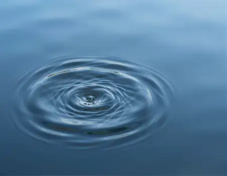 Calm Blue Water Surface with Spiral Pattern reflection