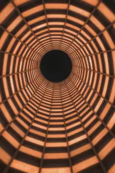 Close-up of Wooden Tunnel with Black Hole grid pattern