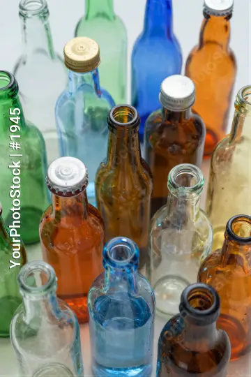 Vintage Glass Bottles on White Surface colorful